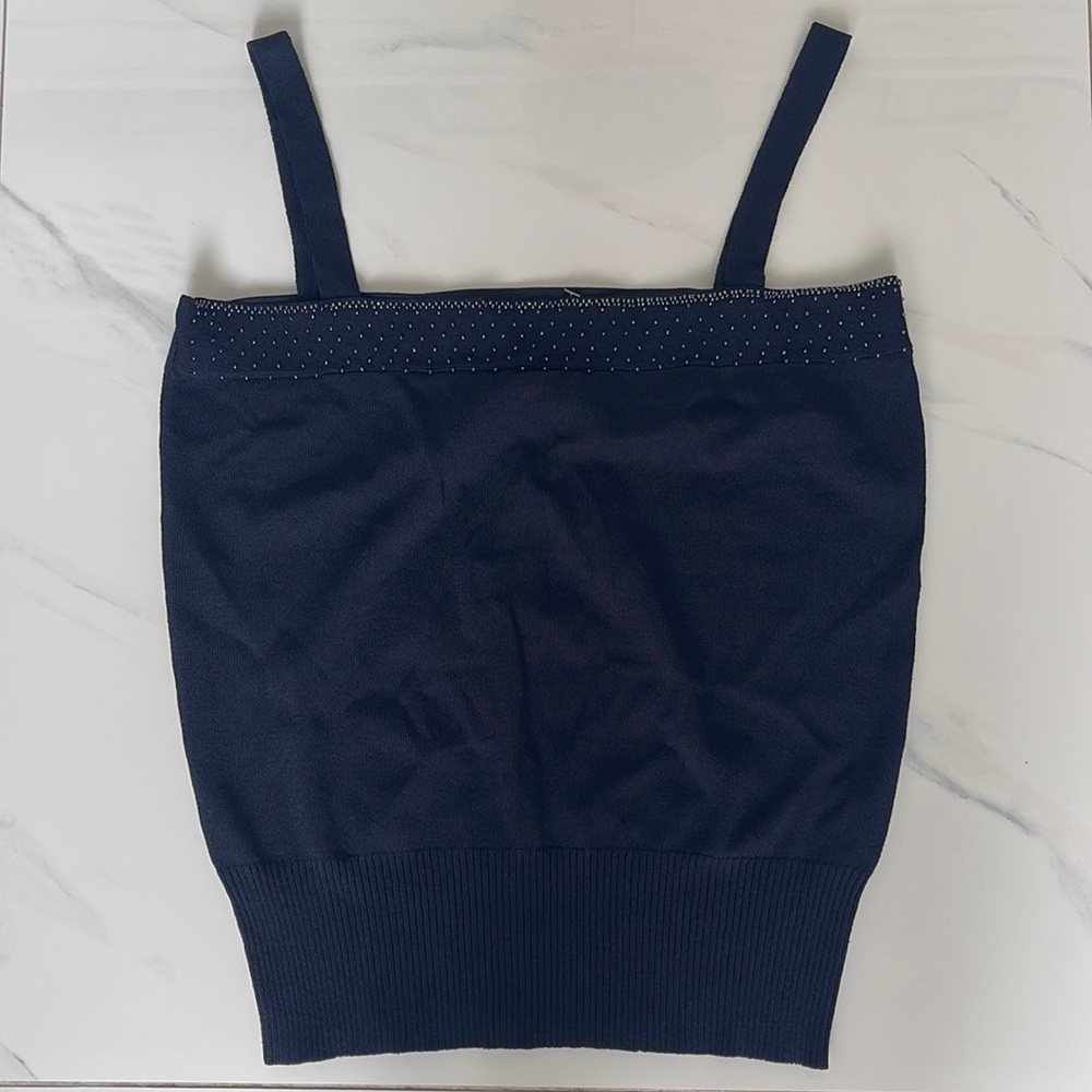 Espirit XL from HK fits as a medium US size. 68% rayon and 32% nylon